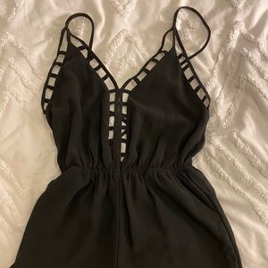 cals black resort romper with cutouts
